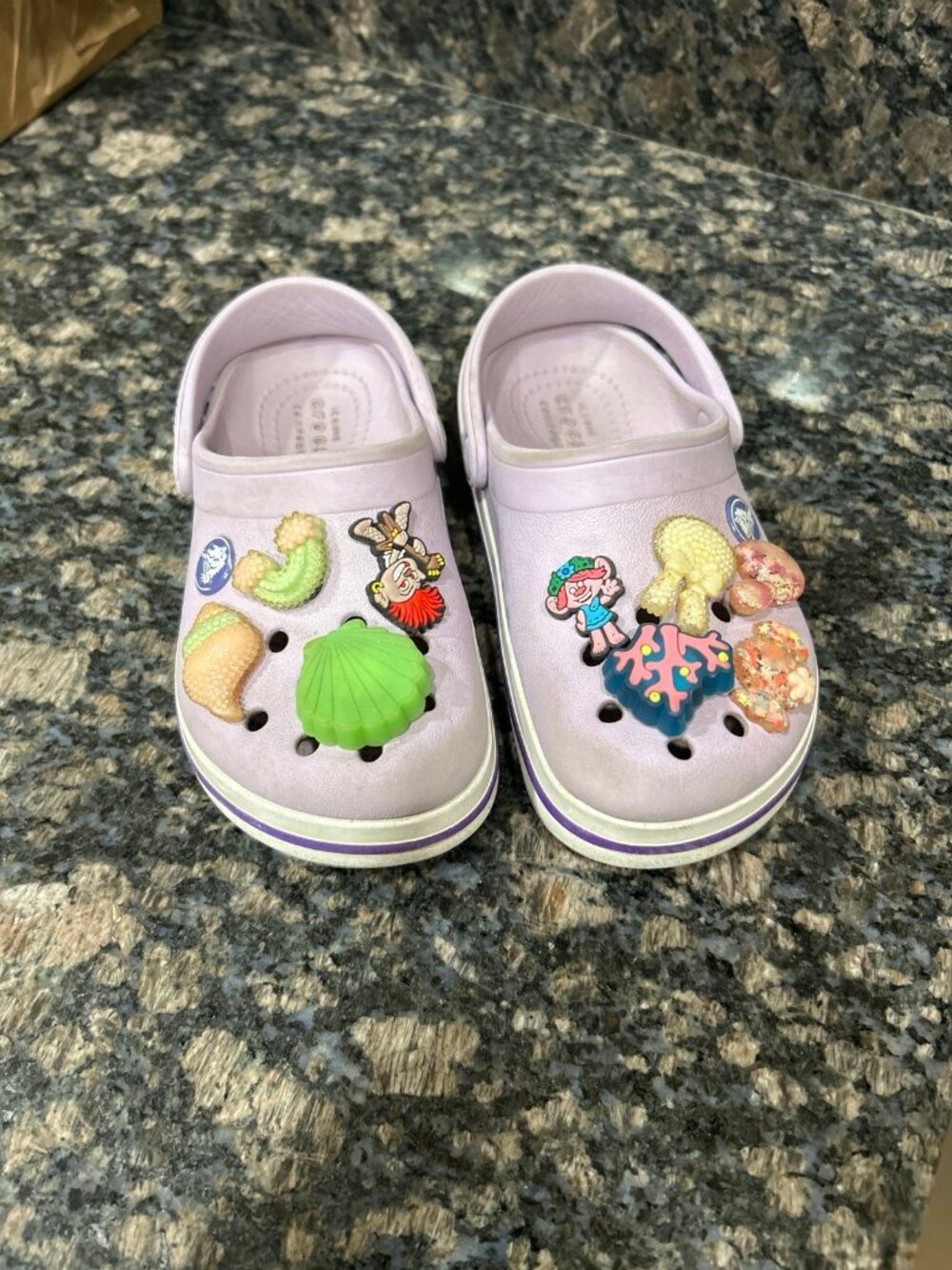 Crocs lavender Crocs clogs are decorated with various colorful themed charms
